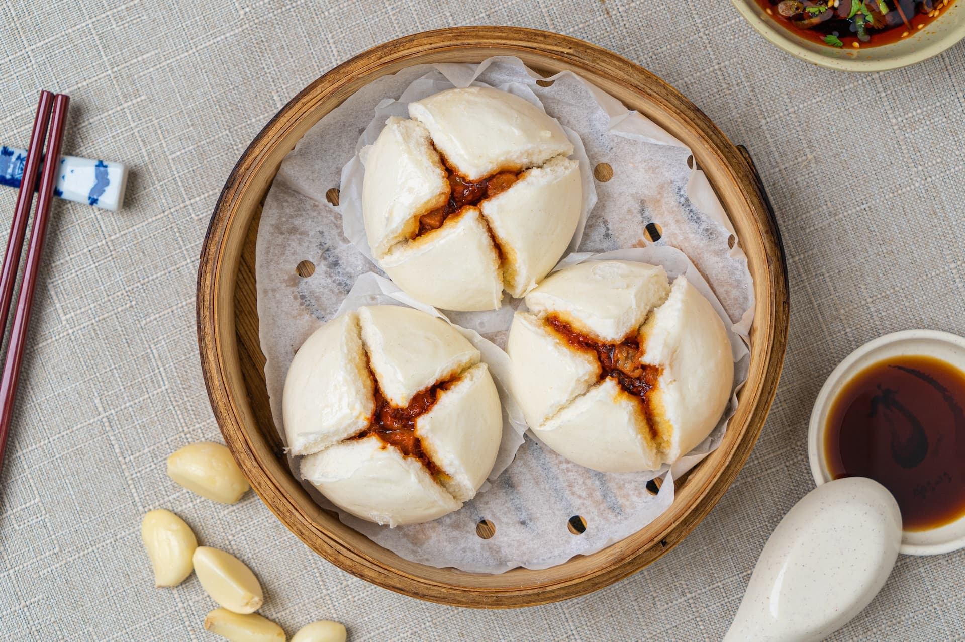 BBQ Pork Bun - Fluffy steamed buns filled with sweet and savory BBQ pork. A delicious treat. | Dim Sum