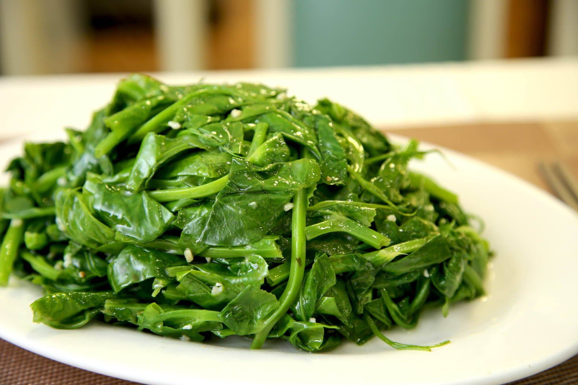 Sautéed Pea Shoots w/ Garlic - Tender and vibrant pea shoots stir-fried with garlic for a simple and delicious  | Vegetable & Tofu