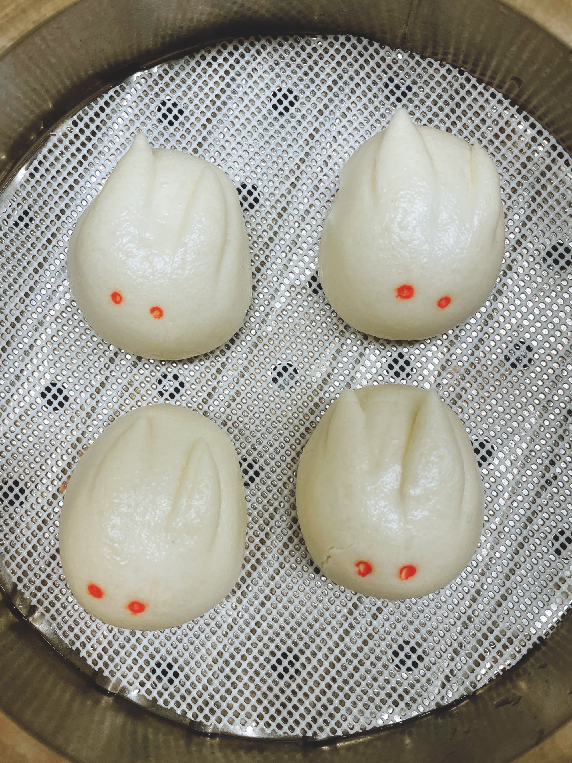 Egg Yolk Steamed Bun - Soft and fluffy steamed buns filled with a rich, creamy egg yolk custard, offeri | Dessert