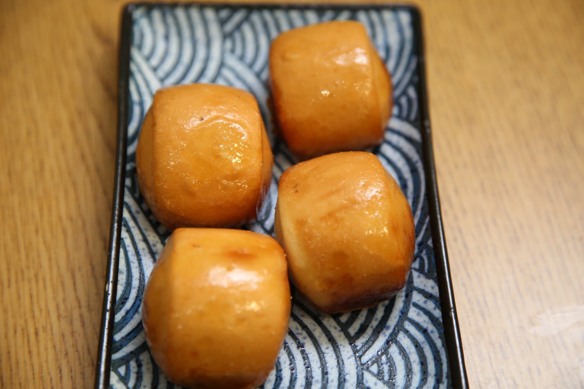 Golden Sweet Bun - Lightly fried to golden perfection, this crispy yet fluffy bun is served with a | Dessert
